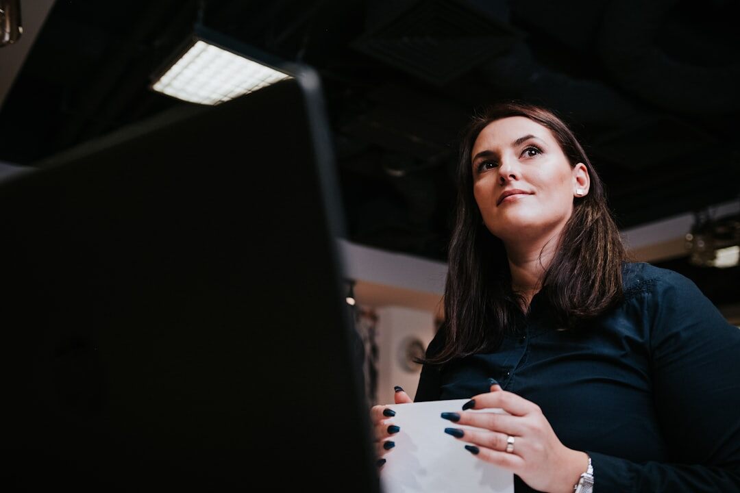 Studio portrait of a Belgian businesswoman in her forties reviewing documents